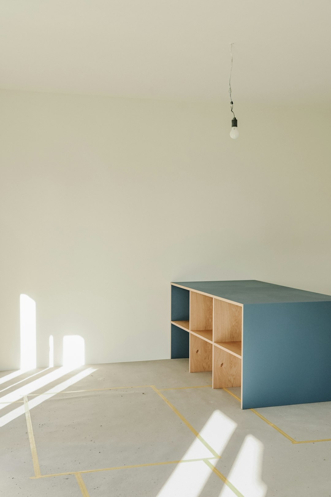 a-blue-shelf-unit-in-an-empty-room-j1typbl-76i